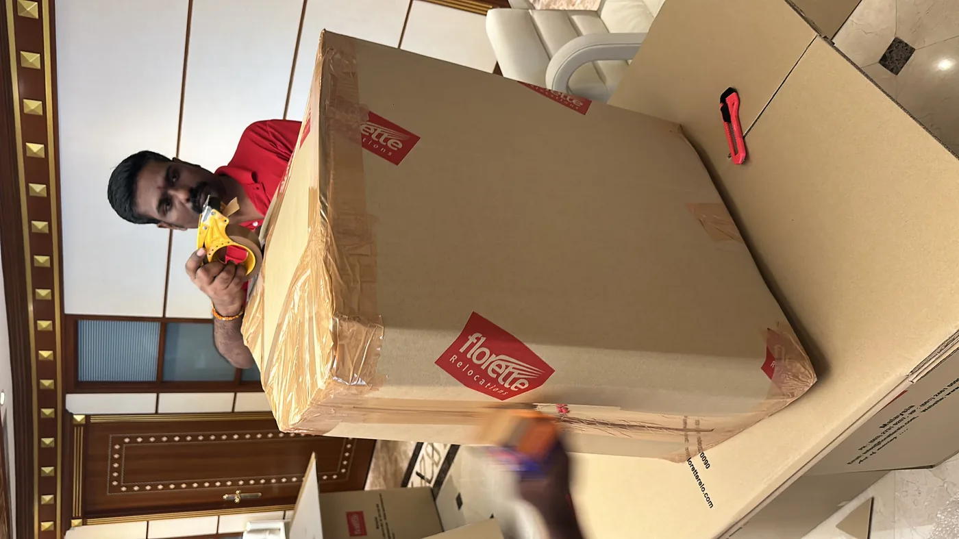 Professional packing of household goods with bubble wrap and secure boxing