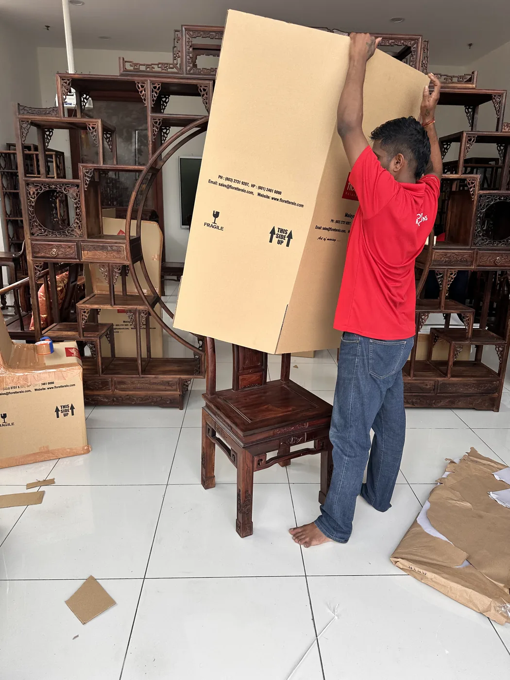 Team preparing wooden crates for relocation shipment