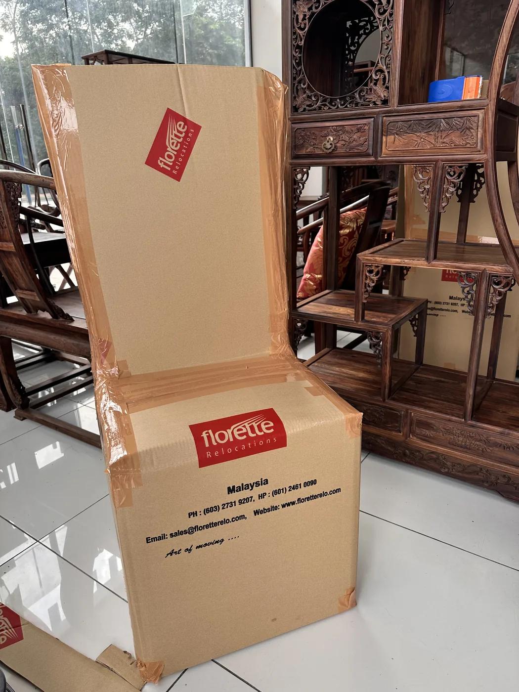 Careful handling of fragile goods during professional packing